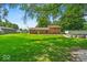 Large backyard featuring a well-manicured lawn and an above-ground pool at 11054 N Shelby 490 W, New Palestine, IN 46163