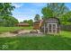 This backyard offers a storage shed and a raised garden with plenty of room for gardening and outdoor enjoyment at 11054 N Shelby 490 W, New Palestine, IN 46163