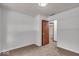 This bedroom features neutral walls, plush carpeting, and a closet at 11054 N Shelby 490 W, New Palestine, IN 46163