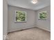 Simple bedroom with updated carpet and two windows for natural light at 11054 N Shelby 490 W, New Palestine, IN 46163
