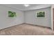 Bedroom with two windows providing natural light and neutral carpet at 11054 N Shelby 490 W, New Palestine, IN 46163