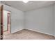 This bedroom features neutral walls, plush carpeting, and a closet at 11054 N Shelby 490 W, New Palestine, IN 46163