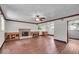 Spacious living room boasts hardwood floors, a fireplace, and lots of natural light at 11054 N Shelby 490 W, New Palestine, IN 46163