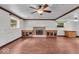 Spacious living room boasts hardwood floors, a fireplace, and lots of natural light at 11054 N Shelby 490 W, New Palestine, IN 46163