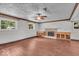 Spacious living room boasts hardwood floors, a fireplace, and lots of natural light at 11054 N Shelby 490 W, New Palestine, IN 46163