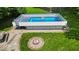 Private backyard featuring an above-ground pool and fire pit, perfect for entertaining outdoors at 11054 N Shelby 490 W, New Palestine, IN 46163