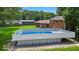 Backyard view of an above-ground pool offering a refreshing oasis for relaxation and recreation at 11054 N Shelby 490 W, New Palestine, IN 46163