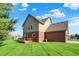 Expansive backyard featuring a well-manicured lawn and a charming wooden deck area at 11599 Braemar Ct, Carmel, IN 46032