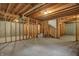 Spacious unfinished basement framed and ready for customization with concrete flooring at 11599 Braemar Ct, Carmel, IN 46032