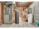 Utility area in the unfinished basement includes a water heater and ductwork at 11599 Braemar Ct, Carmel, IN 46032