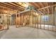 Spacious unfinished basement framed and ready for customization with concrete flooring at 11599 Braemar Ct, Carmel, IN 46032