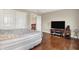 Bright bedroom featuring hardwood floors and neutral paint, with double door closet at 11599 Braemar Ct, Carmel, IN 46032