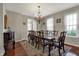 Formal dining room with large windows and elegant chandelier at 11599 Braemar Ct, Carmel, IN 46032