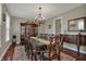Elegant dining room with a chandelier, a large table with ornate chairs and a decorative rug at 11599 Braemar Ct, Carmel, IN 46032