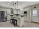 Spacious kitchen featuring white cabinets, stainless steel appliances, granite countertops, and center island at 11599 Braemar Ct, Carmel, IN 46032