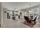Open-concept kitchen and dining area with ample natural light and seating at 11599 Braemar Ct, Carmel, IN 46032