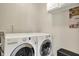 Efficient laundry room with modern washer and dryer units at 11599 Braemar Ct, Carmel, IN 46032