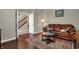 Welcoming living room with hardwood floors, and a stairway view at 11599 Braemar Ct, Carmel, IN 46032