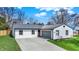 Charming single-story home with a white brick exterior, a gray roof, and a well-manicured lawn at 1280 Casco Bay Cir, Cicero, IN 46034