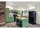 Updated kitchen features custom green cabinetry, butcher block countertops, and stainless steel appliances at 1280 Casco Bay Cir, Cicero, IN 46034