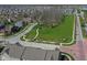 Wide aerial perspective showcasing homes, a lush green park and landscaped streets within the community at 13316 E Lieder Way, Fishers, IN 46037
