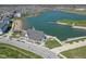 Community aerial view featuring pond, community beach, recreational building, and surrounding homes at 13316 E Lieder Way, Fishers, IN 46037