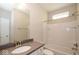 A traditional bathroom has a vanity with a sink, and a shower-tub combo with tiled walls at 13316 E Lieder Way, Fishers, IN 46037