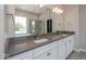 Modern bathroom featuring double vanity, granite countertops, and walk-in shower at 13316 E Lieder Way, Fishers, IN 46037
