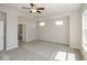 Spacious primary bedroom with plush carpet flooring, windows, and ensuite bathroom at 13316 E Lieder Way, Fishers, IN 46037