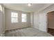 Bright bedroom with carpet flooring, windows, and adjoining bathroom at 13316 E Lieder Way, Fishers, IN 46037