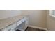 Home office with granite countertop desk, white cabinets, and hardwood flooring at 13316 E Lieder Way, Fishers, IN 46037