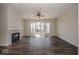 Bright living room featuring hardwood floors, a fireplace, and a sliding glass door at 13316 E Lieder Way, Fishers, IN 46037