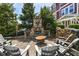 Cozy outdoor patio with a stone fireplace and comfortable seating at 13316 E Lieder Way, Fishers, IN 46037