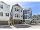 Modern three-story townhome with a garage and ample windows at 13316 E Lieder Way, Fishers, IN 46037