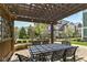 Inviting outdoor patio with stylish furniture, pergola, and scenic views of the community landscaping at 13316 E Lieder Way, Fishers, IN 46037