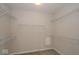An empty walk-in closet features white wire shelving all around, maximizing storage and organization at 13316 E Lieder Way, Fishers, IN 46037