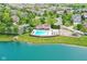 Gorgeous aerial view of the community pool, clubhouse, and surrounding neighborhood, offering a serene lakeside setting at 13316 E Lieder Way, Fishers, IN 46037