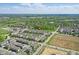 An aerial view shows a large neighborhood surrounded by open land, highlighting the community's layout and location at 13510 E 131St St, Fishers, IN 46037