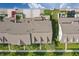 Aerial view showcases townhomes, green spaces, and driveway parking at 13510 E 131St St, Fishers, IN 46037