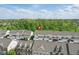 Aerial view showcases townhouse community with garages and trees at 13510 E 131St St, Fishers, IN 46037
