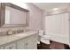 Bathroom featuring a vanity with marble countertop, a framed mirror, and a shower-tub combination at 13510 E 131St St, Fishers, IN 46037