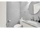 Elegant half bathroom featuring marble countertop, modern toilet, and a round mirror above sink at 13510 E 131St St, Fishers, IN 46037