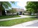 Charming clubhouse exterior boasts stone accents, shingle siding and manicured landscaping in a welcoming neighborhood setting at 13510 E 131St St, Fishers, IN 46037