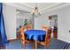 View of a dining area featuring hardwood floors, a chandelier and an open staircase to the upstairs at 13510 E 131St St, Fishers, IN 46037