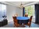 Charming dining room featuring a round table, hardwood floors, and natural lighting from a large window at 13510 E 131St St, Fishers, IN 46037