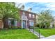 Inviting red brick townhouse with a well-manicured lawn and welcoming front entrance at 13510 E 131St St, Fishers, IN 46037
