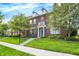 Charming red brick townhouse with a front yard and inviting entrance at 13510 E 131St St, Fishers, IN 46037