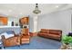 Open-concept living area features hardwood floors, neutral paint, and a glimpse of the kitchen at 13510 E 131St St, Fishers, IN 46037