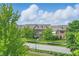 Street view of townhouses with beautiful landscaping and curb appeal in a residential neighborhood at 13510 E 131St St, Fishers, IN 46037