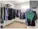 Functional walk-in closet featuring hanging rods, shelves, and ample storage space at 13510 E 131St St, Fishers, IN 46037